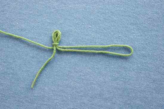 Measure out a tail that is twice the length you would need for a Long-Tail Cast On. Fold this in half and make a slip knot where the two strands come together, leaving a short tail for weaving in later. Place the slipknot on your needle.